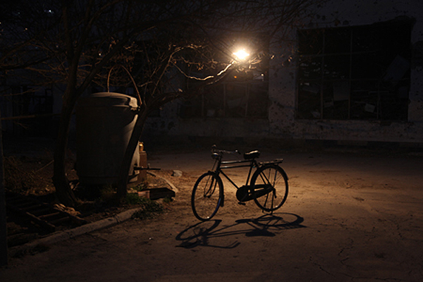 Many Afghans ride bicycles in order to avoid traffic in the city. Kabul, 2011.