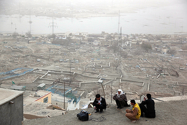 An Afghan family watches television in Shohada-i-Sahliheen in the south of the city. Television and other independent media have developed rapidly in Afghanistan over the last decade. Kabul, 2011. 