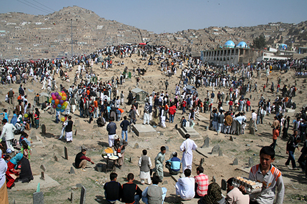 Afghan families picnic on the hills and mountains surrounding Kabul during the holiday of Eid ul Adha (Eid Qurban), the festival of sacrifice. This festival remembers the prophet Ibrahim's willingness to sacrifice his son when ordered to do so by God. During the festival Muslims who can afford to, sacrifice domestic animals, usually sheep, as a symbol of Ibrahim's sacrifice. The Qurbani meat is distributed among family, friends and the poor. This day also marks the end of the Hajj, the annual pilgrimage to Mecca. It takes place on the 10th day of Dhul-Hijjah, the last month of the Islamic calendar. Kabul, 2010. 