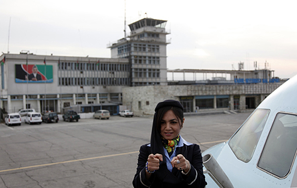 "I am a flight attendant. If I did it, you can do it too." Kabul airport, 2011.